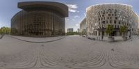 a 360 - panorama of a square with multiple buildings and a sky background in a city