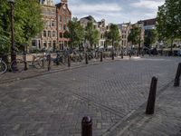 a city square with parked bicycle's in the center of a park area in holland