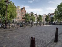 a city square with parked bicycle's in the center of a park area in holland