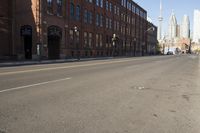 City Street with Asphalt and Brick Buildings