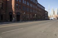 City Street with Asphalt and Brick Buildings
