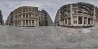 a three by four view of a building on the street outside with cobblestones