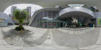 a fish eye photo with an angled lens, of a city street and a building