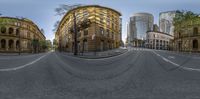 the city street with a car driving down it is a very nice photo idea for a fish eye view