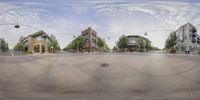 an upside down photograph of a city street and buildings on one side of a circle