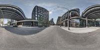 the distorted image shows the view of the street from a different angle on a fish eye lens