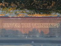 a city street with an overhead view of the slogan, stop being in the ditch