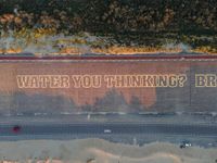 a city street with an overhead view of the slogan, stop being in the ditch