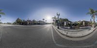 this is a photo of a street in a city, taken 360 - view looking out at a man