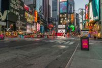 a city street with tall buildings and a bus stop sign that says times square in front