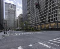 a city street is lined with buildings and street lights in front of skyscrapers and buildings