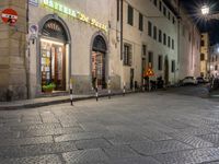 this is an empty city street in an italian city at night time to describe what's coming here