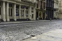 an older street with many old buildings and a bike in front of the building's doors