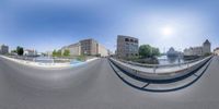 this is a 360 - degree view of a city skateboarder riding the ramp