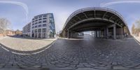 an image of buildings from the street at the city streets in a fish eye view