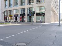 a city street that has several streets, a manhole, and a fire hydrant