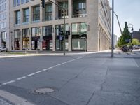 a city street that has several streets, a manhole, and a fire hydrant