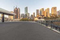 there is a view of the city across the bridge from the subway station with no people