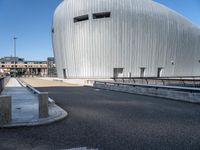 a view of the building next to a highway with no traffic or traffic cones around