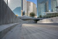 an empty cement walkway has been replaced from the road with concrete steps leading to the entrance