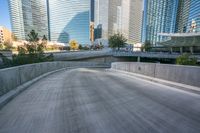 an empty cement walkway has been replaced from the road with concrete steps leading to the entrance