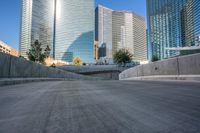 an empty cement walkway has been replaced from the road with concrete steps leading to the entrance