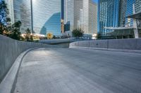 an empty cement walkway has been replaced from the road with concrete steps leading to the entrance