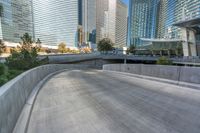 an empty cement walkway has been replaced from the road with concrete steps leading to the entrance