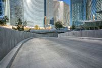 an empty cement walkway has been replaced from the road with concrete steps leading to the entrance