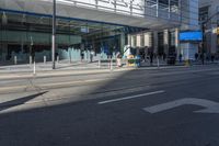 the sidewalk and sidewalk are covered with glass in this city area on a sunny day