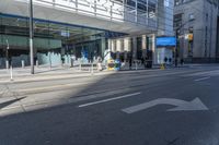 the sidewalk and sidewalk are covered with glass in this city area on a sunny day