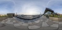 this is a 360 - view of a large building with a sky background in a circular lens