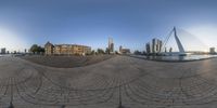 the view from a spherical mirror of a building in the city with skyscrapers in the distance