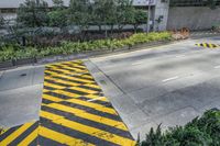 the yellow and black striped painted on the street curb is very unique looking and unique