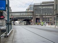 a street has a blue sign that says the station for friendstrape on it