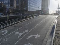 the sun is setting on a very big city skyline in the afternoon sun reflects off the glass windows and sidewalk