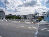 the side walk bridge crosses the city over a small highway, and goes through a pedestrian traffic