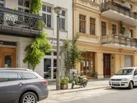 Cityscape in Berlin, Germany with Residential Apartments and Parked Vehicles