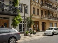 Cityscape in Berlin, Germany with Residential Apartments and Parked Vehicles