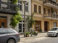 Cityscape in Berlin, Germany with Residential Apartments and Parked Vehicles