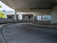 a car is driving on the highway through an underground parking garage area in a city