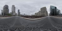 a view of the city across a grid of mesh as seen through an outside fence