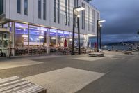 a picture of a place with benches in it's open space near a building