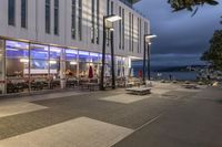 a picture of a place with benches in it's open space near a building