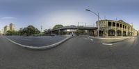 this is a 360 - vr view of a street with a building in the background