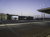 Cityscape at Dawn with Rolling Streets and Street Lights