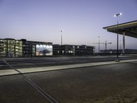 Cityscape at Dawn with Rolling Streets and Street Lights