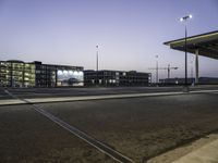 Cityscape at Dawn with Rolling Streets and Street Lights