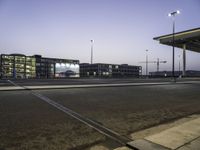 Cityscape at Dawn with Rolling Streets and Street Lights