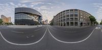 a couple of street view shots of a city street with buildings on either side and a blue sky above